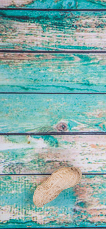 Peanut or ground nut over wooden backgroundの写真素材