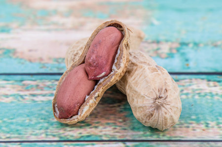 Peanut or ground nut over wooden background