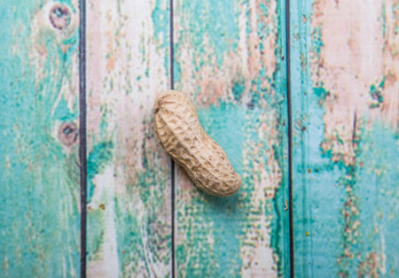 Peanut or ground nut over wooden background