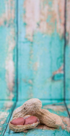 Peanut or ground nut over wooden background