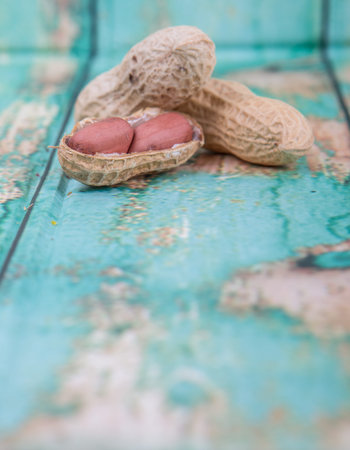 Peanut or ground nut over wooden background