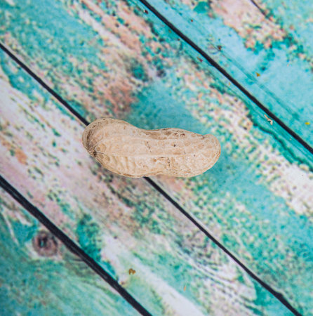 Peanut or ground nut over wooden backgroundの写真素材
