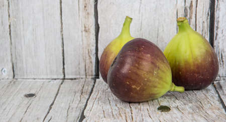 Fig fruits over wooden backgroundの写真素材