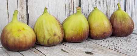 Fig fruits over wooden backgroundの写真素材