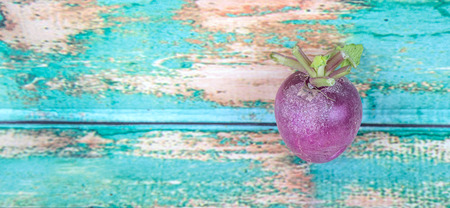 Small purple radish vegetable over wooden backgroundの写真素材