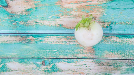 Small white radish vegetable over wooden backgroundの写真素材