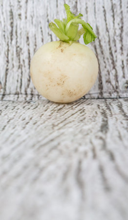 Small white radish vegetable over wooden background