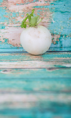 Small white radish vegetable over wooden backgroundの写真素材