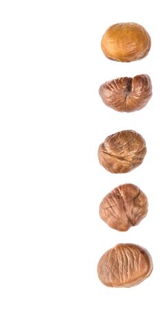 Roasted whole peeled chestnut over white backgroundの写真素材