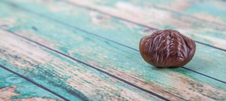 Roasted whole peeled chestnut over white backgroundの写真素材