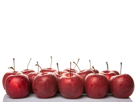 Crab apple fruit over white background
