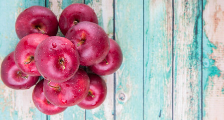 Crab apple fruit over wooden backgroundの写真素材