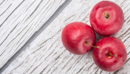 Crab apple fruit over wooden backgroundの写真素材