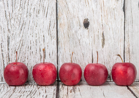 Crab apple fruit over wooden backgroundの写真素材