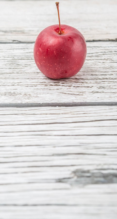 Crab apple fruit over wooden backgroundの写真素材