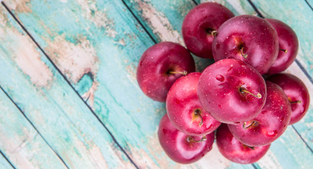 Crab apple fruit over wooden backgroundの写真素材