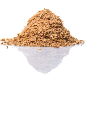 Dried galangal powder over white backgroundの写真素材