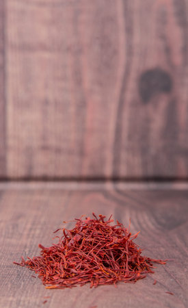 Dried saffron spice over wooden backgroundの写真素材