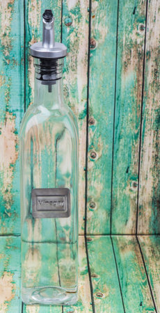 White vinegar over wooden backgroundの写真素材