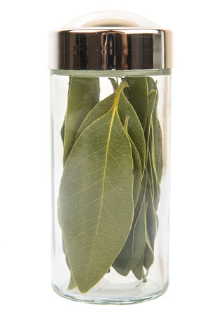 Dried laurel leaves herbs over white backgroundの写真素材