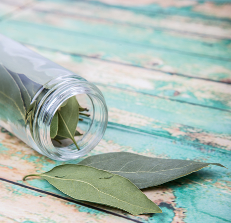Dried laurel leaves over wooden backgroundの写真素材