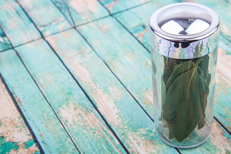 Dried laurel leaves over wooden backgroundの写真素材