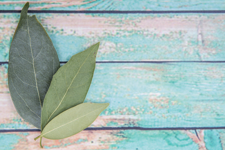 Dried laurel leaves over wooden backgroundの写真素材