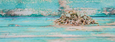 Dried linden flower herbal tea over wooden backgroundの写真素材