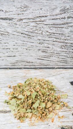 Dried linden flower herbal tea over wooden backgroundの写真素材