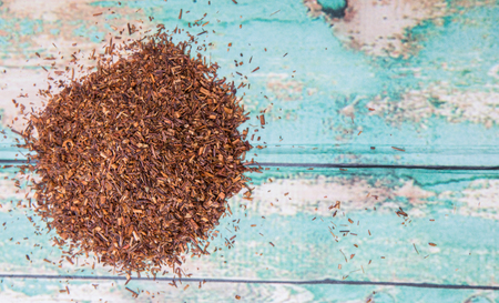 Dried rooibos herbal tea over wooden backgroundの写真素材