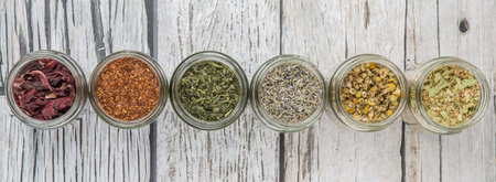 Dried herbal tea lavender, Japanese green tea, hibiscus, chamomile, linden flower, rooibos in mason...
