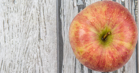 Fresh Japanese Fuji apple over wooden backgroundの写真素材