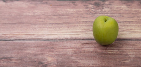 Pickled olive over wooden backgroundの写真素材