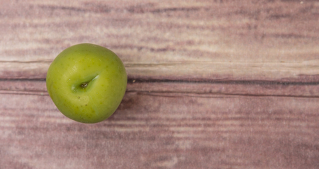 Pickled olive fruit over wooden backgroundの写真素材