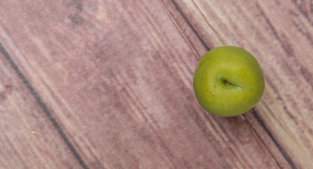 Pickled olive fruit over wooden backgroundの写真素材