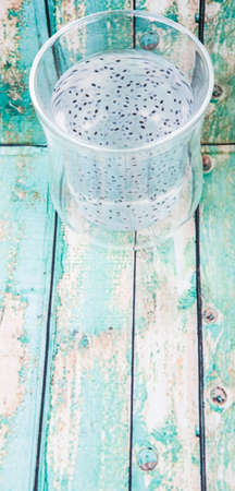 Sweet basil seed drink in a bottle over wooden backgroundの写真素材