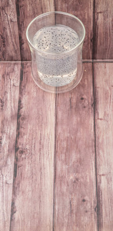 Sweet basil seed drink in a bottle over wooden backgroundの写真素材