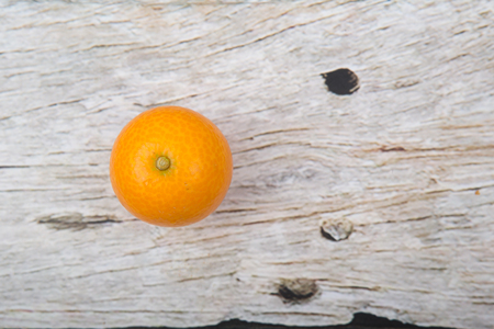 Kumquat fruit over wooden backgroundの写真素材