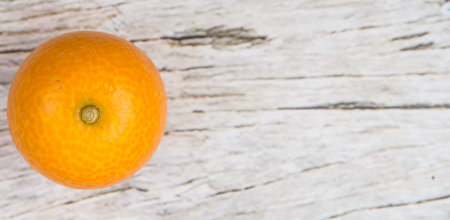 Kumquat fruit over wooden backgroundの写真素材