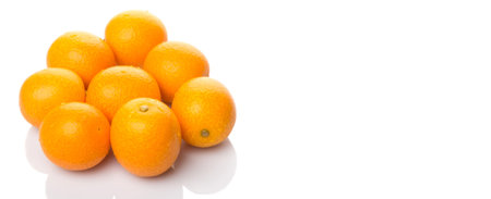 Fresh kumquat fruits over white backgroundの写真素材