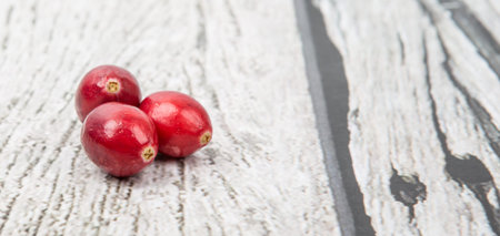 Cranberries fruit over wooden backgroundの写真素材