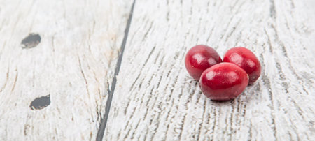 Cranberries fruit over wooden backgroundの写真素材