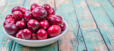 Cranberries fruit over wooden backgroundの写真素材