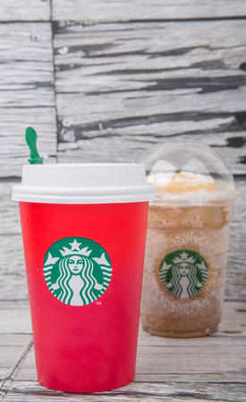 TOKYO, JAPAN - DECEMBER 2ND, 2015. Starbuck frapuccino over wooden background. Founded in 1971, Starbucks is the largest coffeehouse company in the world.のeditorial素材