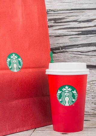 TOKYO, JAPAN - DECEMBER 2ND, 2015. Starbuck frapuccino over wooden background. Founded in 1971, Starbucks is the largest coffeehouse company in the world.のeditorial素材