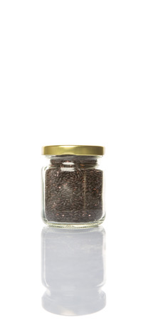 Black millet in mason jars over wooden backgroundの写真素材