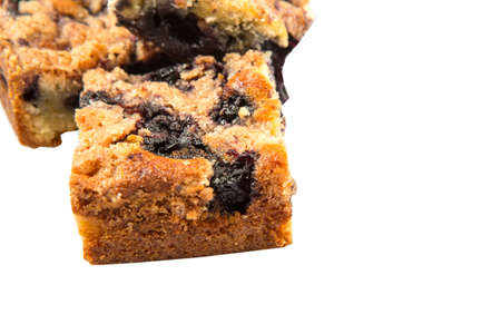 Portions of blueberry sponge cake over white backgroundの写真素材