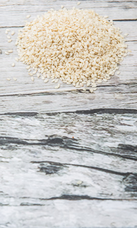 White sesame seed over wooden backgroundの写真素材