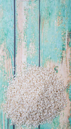 White sesame seed over wooden backgroundの写真素材