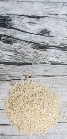 White sesame seed over wooden backgroundの写真素材